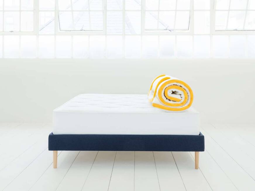 Eve mattress topper on bed